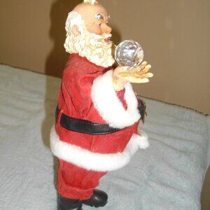 Possible Dreams Clothtique Santa with crystal ball figurine.